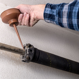 Hire Professionals to Resolve Your Broken Garage Door Spring Problems